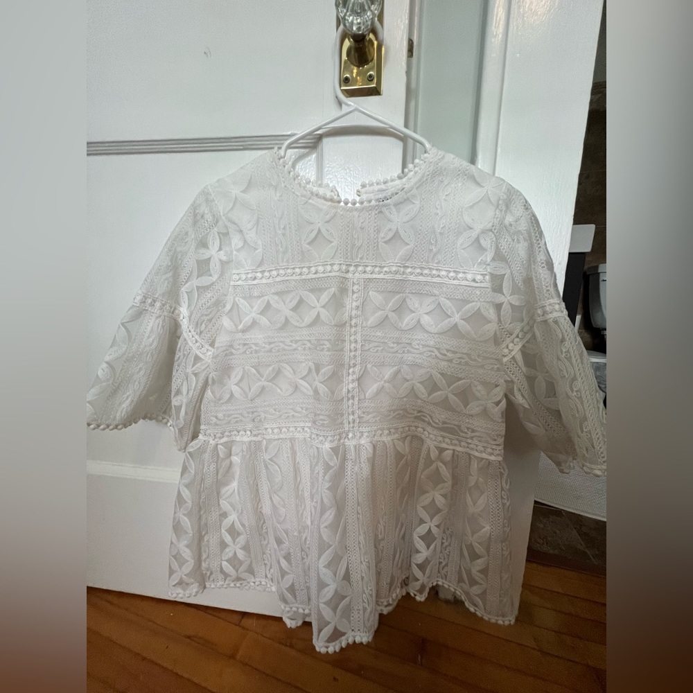 White, lace top by Chicwish. See through sleeves with lined body.